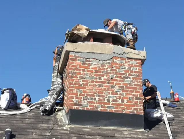 Highland Chimney Sweep installing a custom chimney crown in Highland, CA