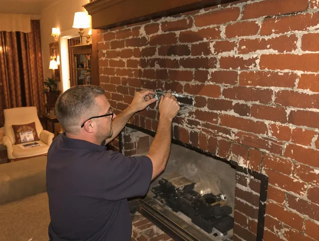 Highland Chimney Sweep expert fixing a fireplace in Highland, CA